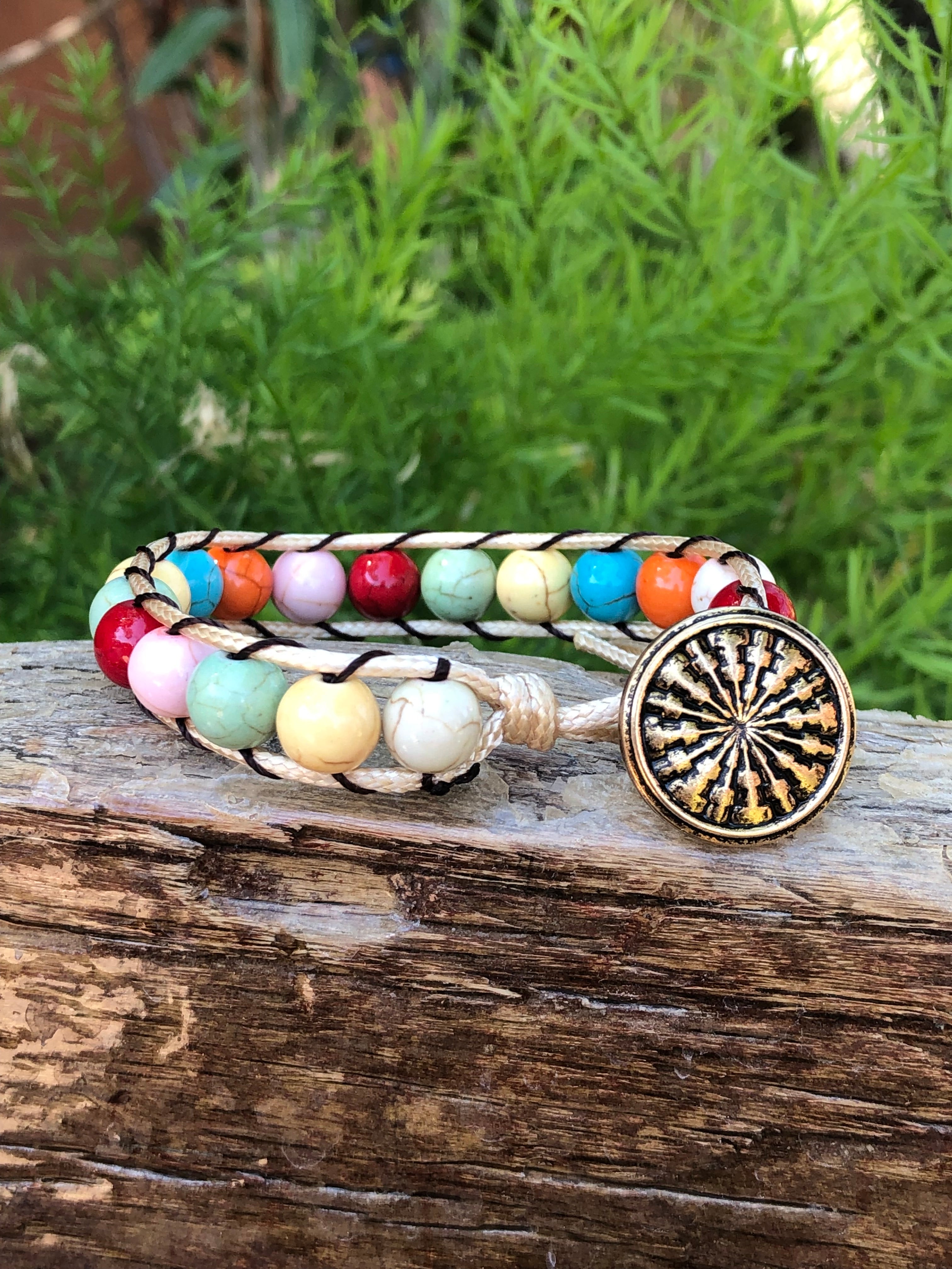 Golden thread bracelet with colored beads