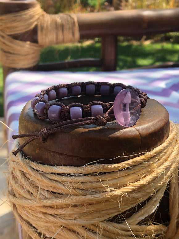 Brown thread bracelet with purple stone