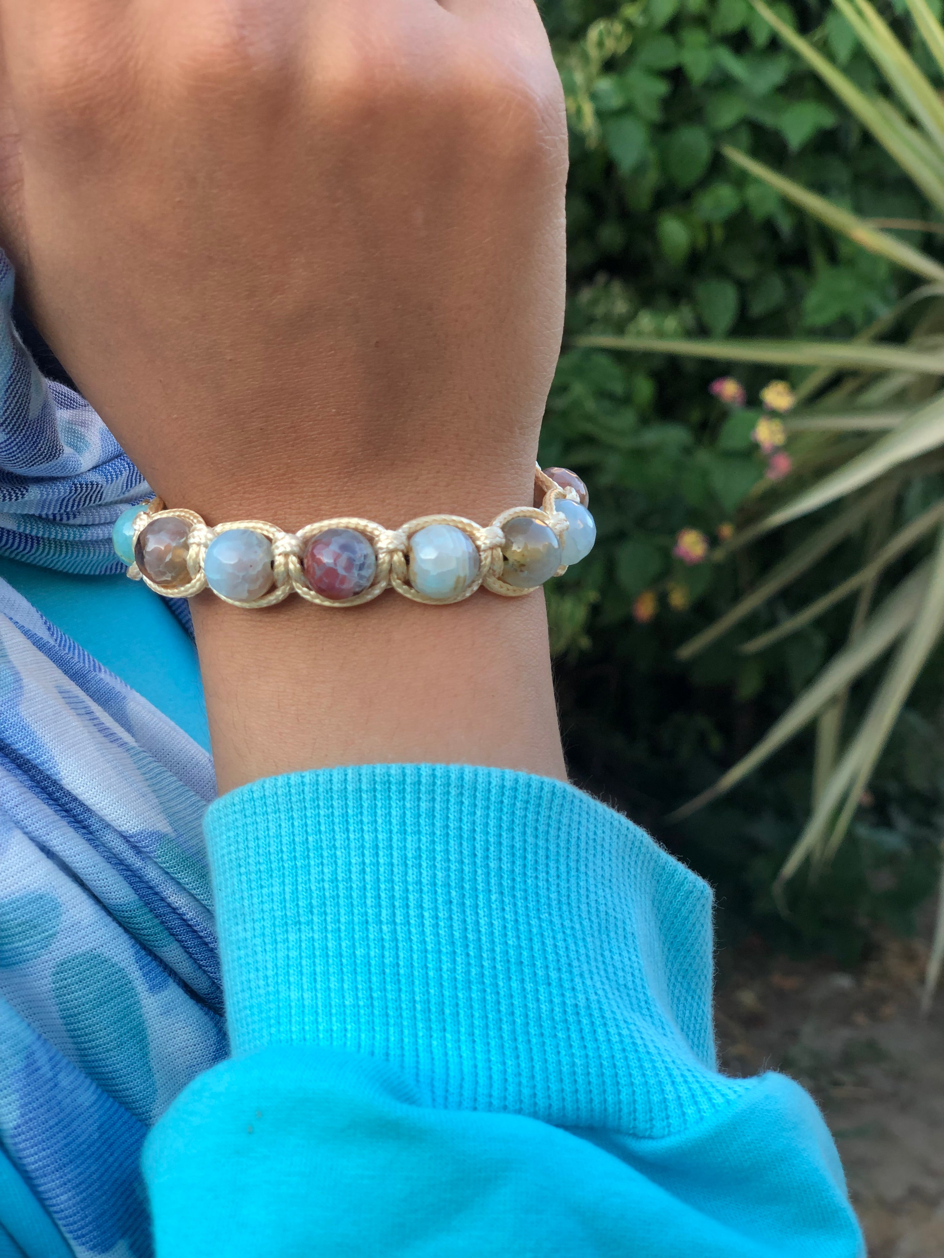 Golden thread bracelet with sky blue and light brown stone