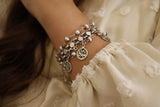 Silver bracelet dangling words with pearls