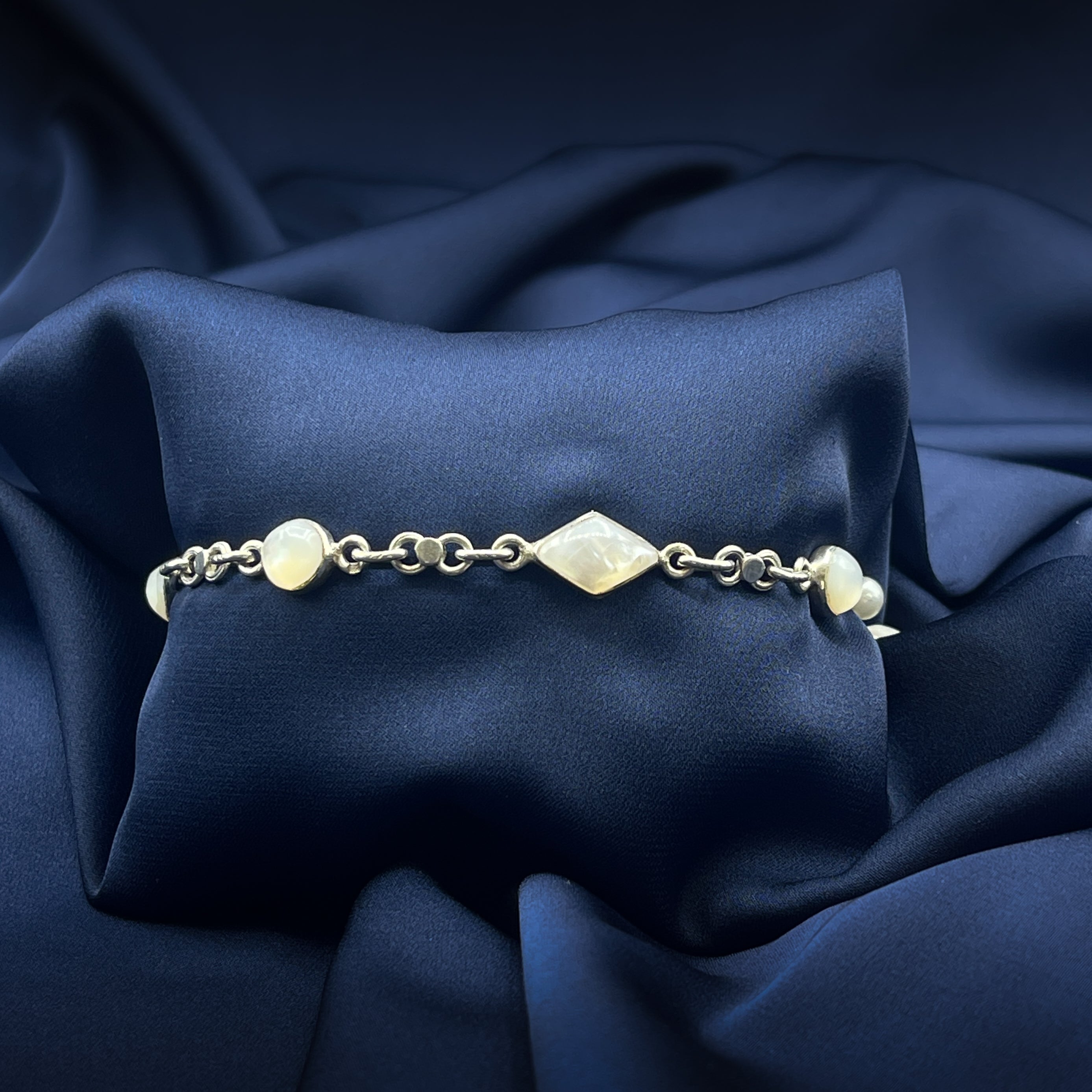 Silver bracelet with diamond-shaped beads