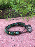 Brown thread bracelet with green agate and golden beads