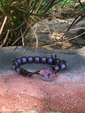 Brown thread bracelet with purple stone