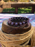 Brown thread bracelet with purple stone