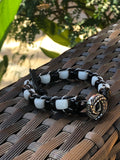 Black thread bracelet with white and black stone