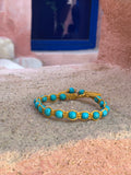 Turquoise train bracelet with macrame clasp