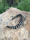 Bracelet of black agate beads with macrame clasp