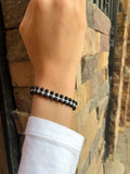 Bracelet of black agate beads with macrame clasp