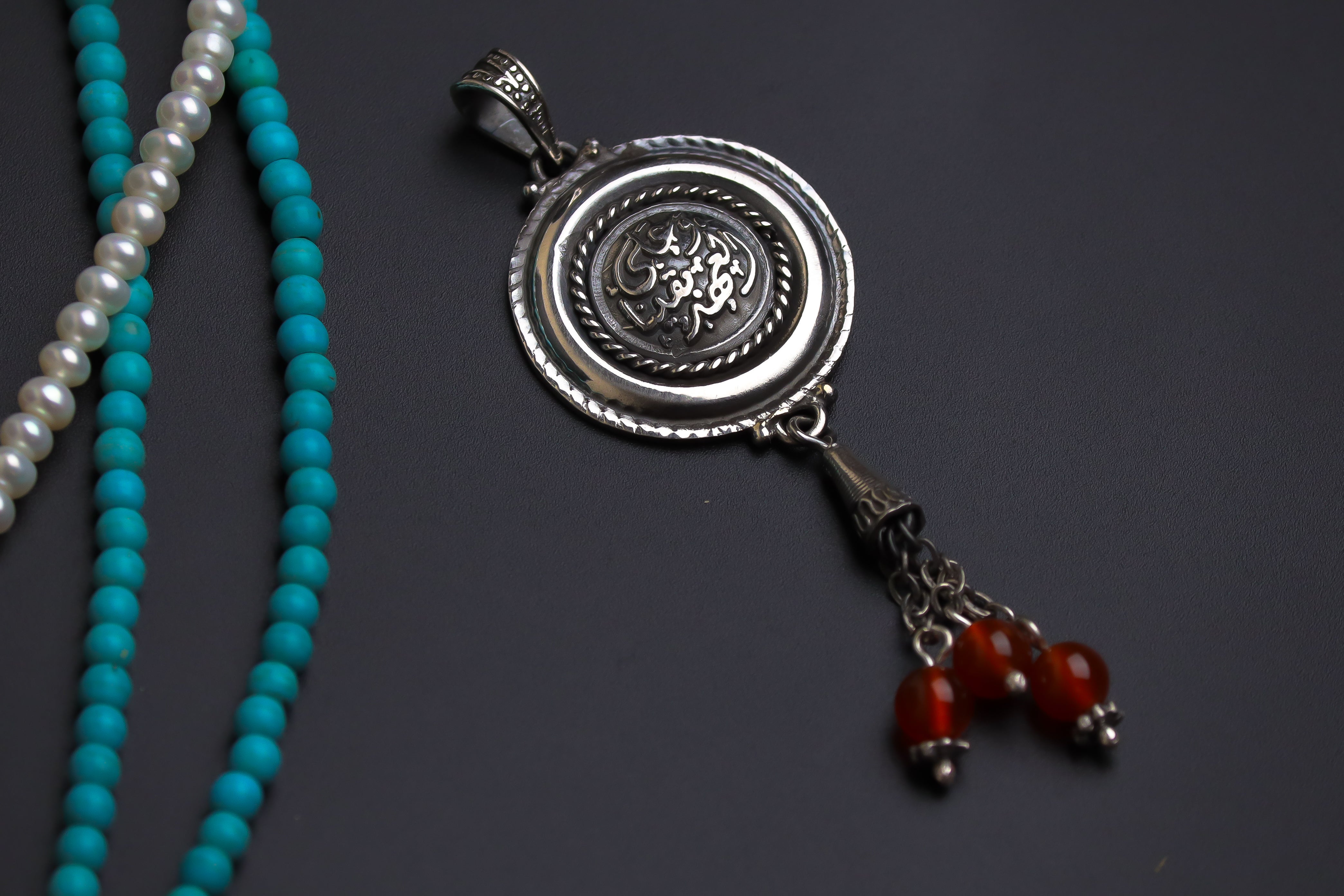 Commitment Pendant With Maroon Stones
