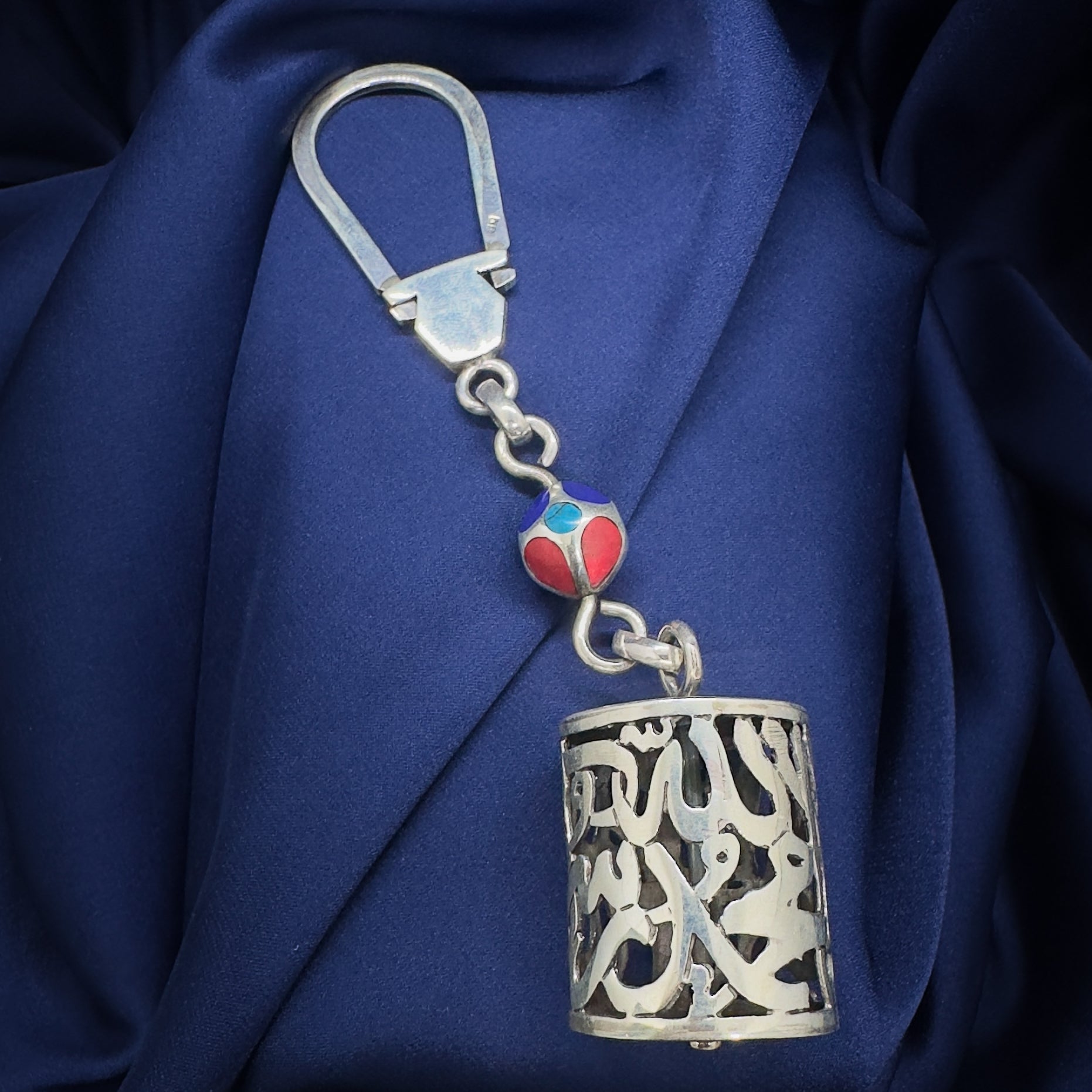 Silver keychain with Arabic calligraphy and colorful bead 