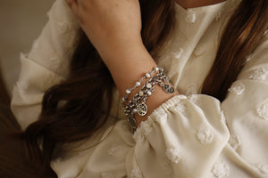 Silver bracelet dangling words with pearls