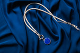 Dark blue circular pendant