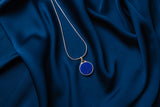 Dark blue circular pendant