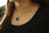 Dark blue circular pendant