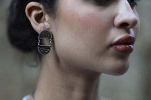 "My eyes get used" semicircle earring